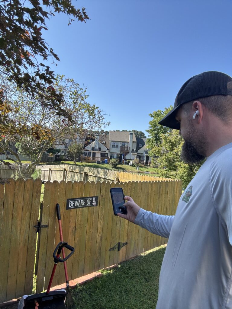 Yard Patrol Technician Taking a Locked Gate Photo after Completing Pooper Scooper Service.